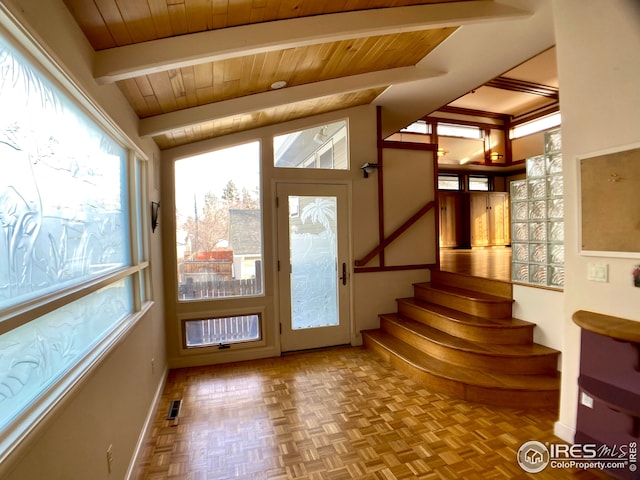 doorway to outside with wood ceiling, lofted ceiling with beams, and light parquet flooring