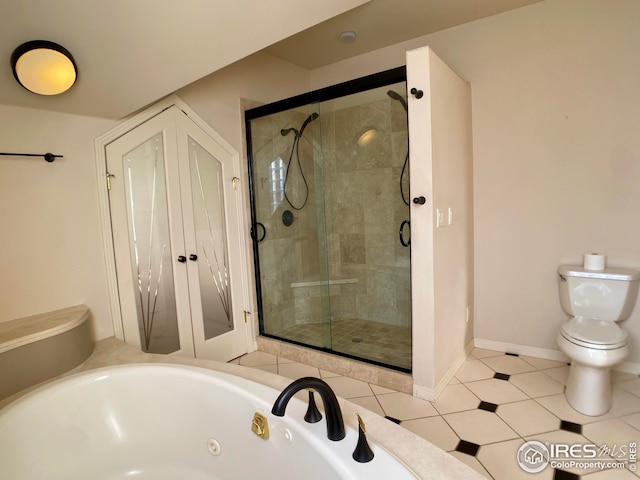 bathroom featuring toilet and shower with separate bathtub