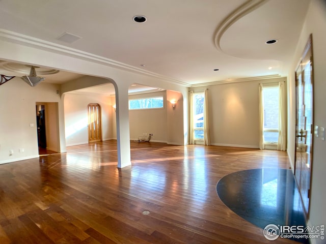 unfurnished room featuring ornamental molding and hardwood / wood-style floors