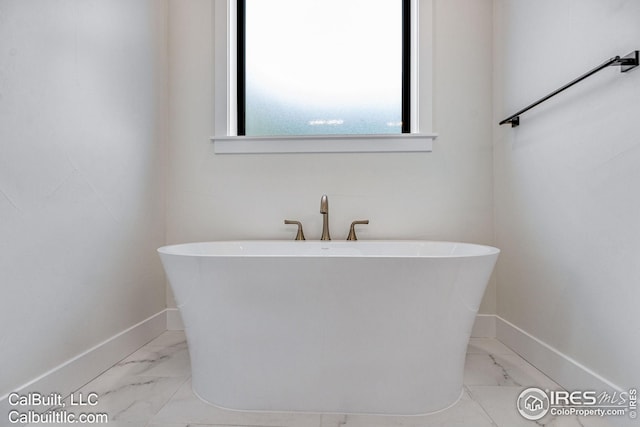 bathroom with a washtub