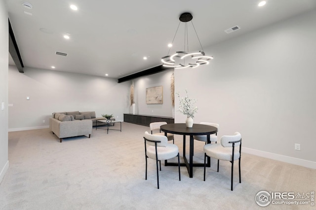 dining space with baseboards, visible vents, light carpet, and recessed lighting