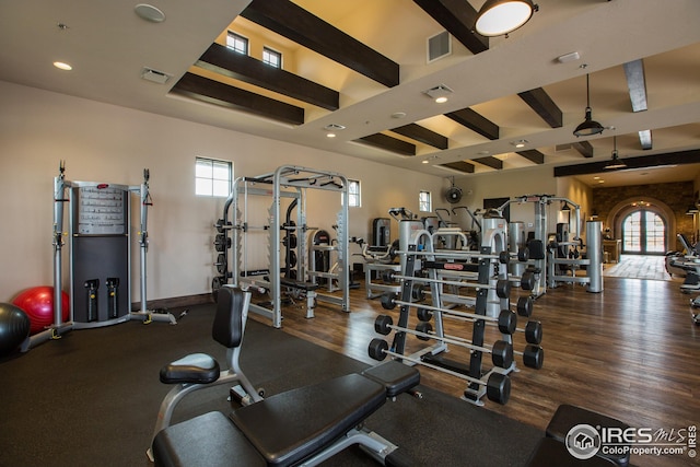 gym with baseboards, visible vents, wood finished floors, and recessed lighting