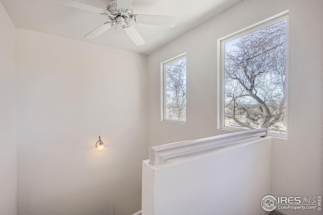 interior space featuring ceiling fan