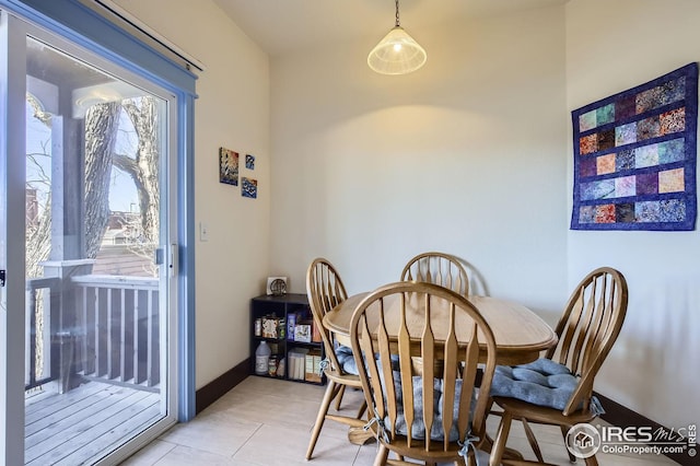 dining area with light tile patterned floors