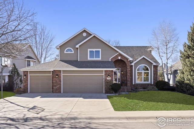 view of front of home featuring a garage and a front yard