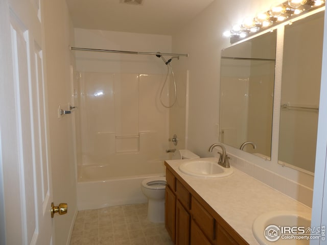 full bathroom featuring shower / tub combination, vanity, and toilet