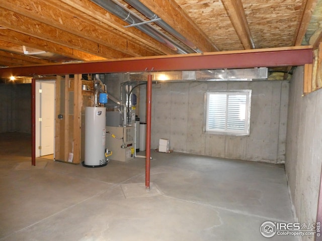 basement featuring heating unit and water heater