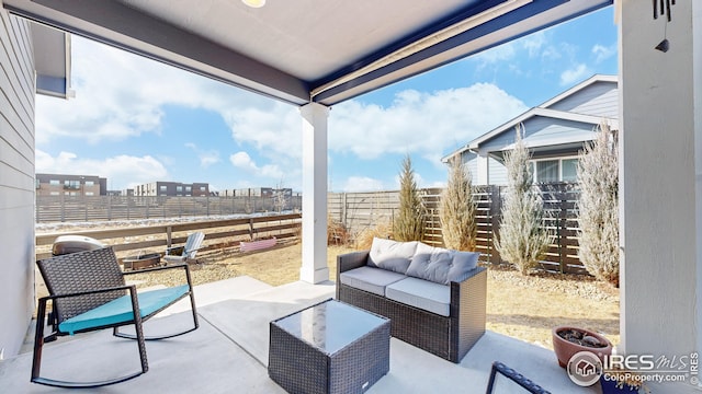 view of patio / terrace featuring a fenced backyard and an outdoor living space