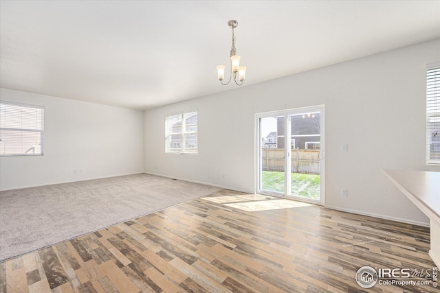 interior space featuring a notable chandelier and wood-type flooring