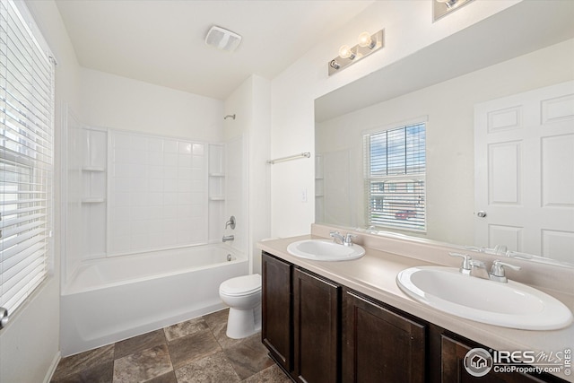 full bathroom featuring vanity, toilet, and shower / bath combination