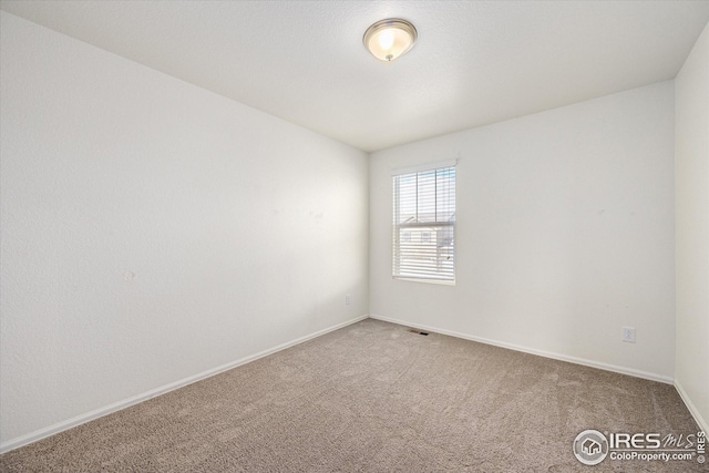 empty room with carpet floors