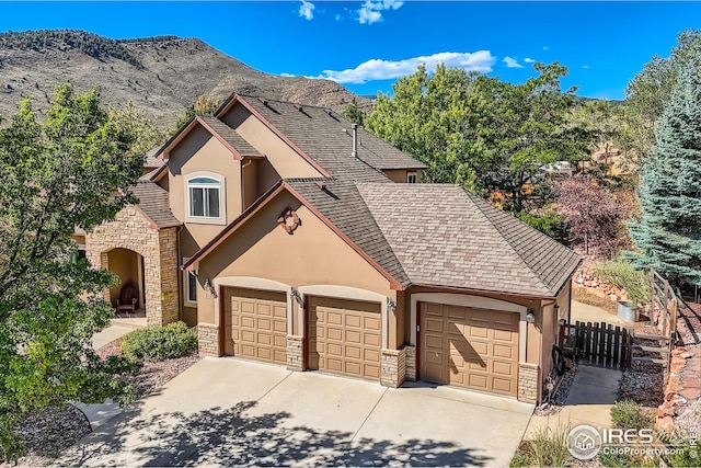 view of front of house featuring a mountain view and a garage