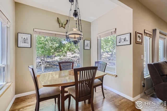 dining space with light wood-type flooring