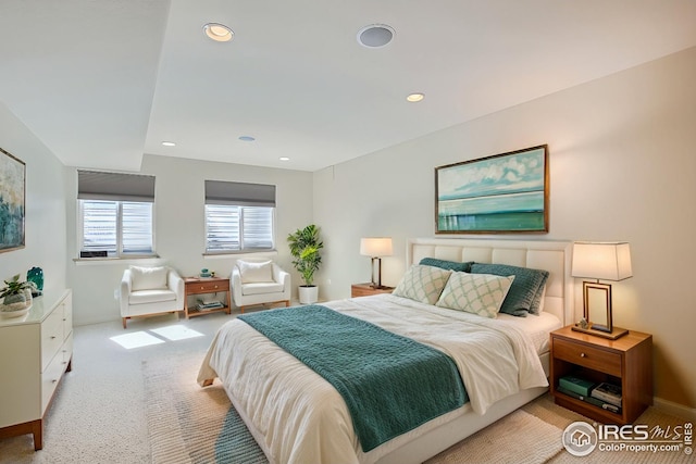 bedroom with light colored carpet