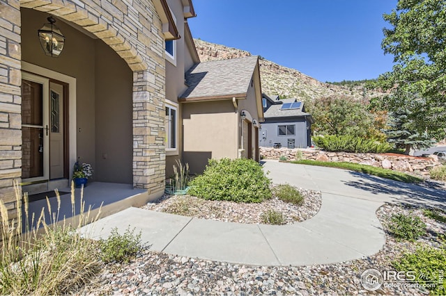 view of home's exterior with a mountain view