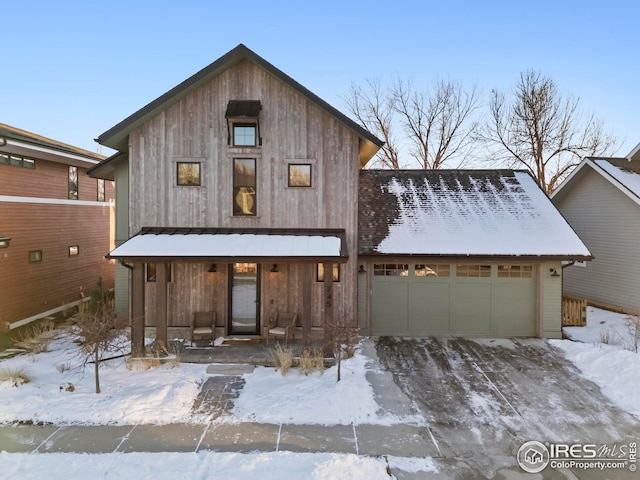 view of front of house with a garage and covered porch