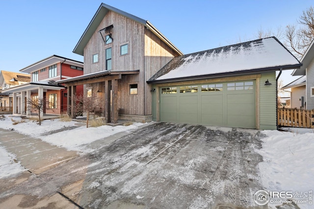 view of front of property with a porch and a garage