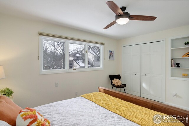 bedroom with a closet, wood finished floors, and a ceiling fan