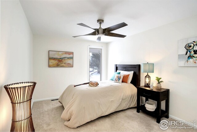 bedroom featuring carpet flooring, a ceiling fan, baseboards, and visible vents