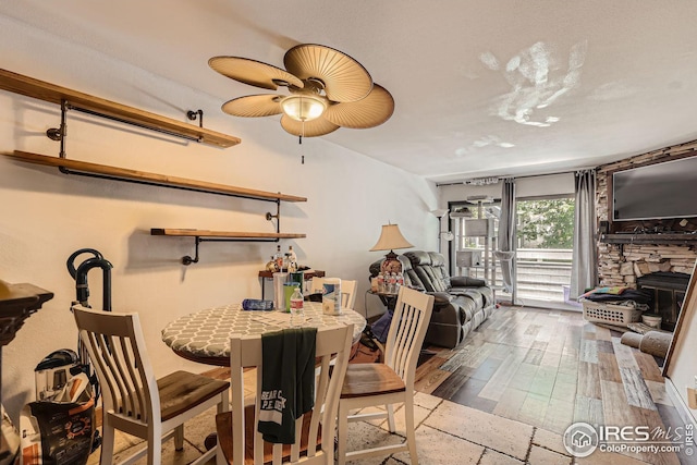 dining space featuring ceiling fan and wood finished floors