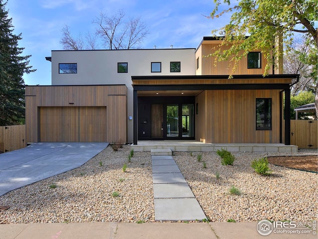 rear view of property featuring a garage