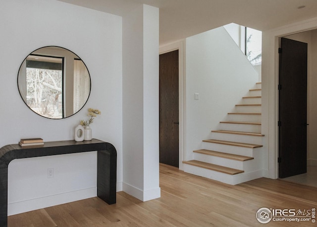 bathroom with vanity, toilet, and a tile shower
