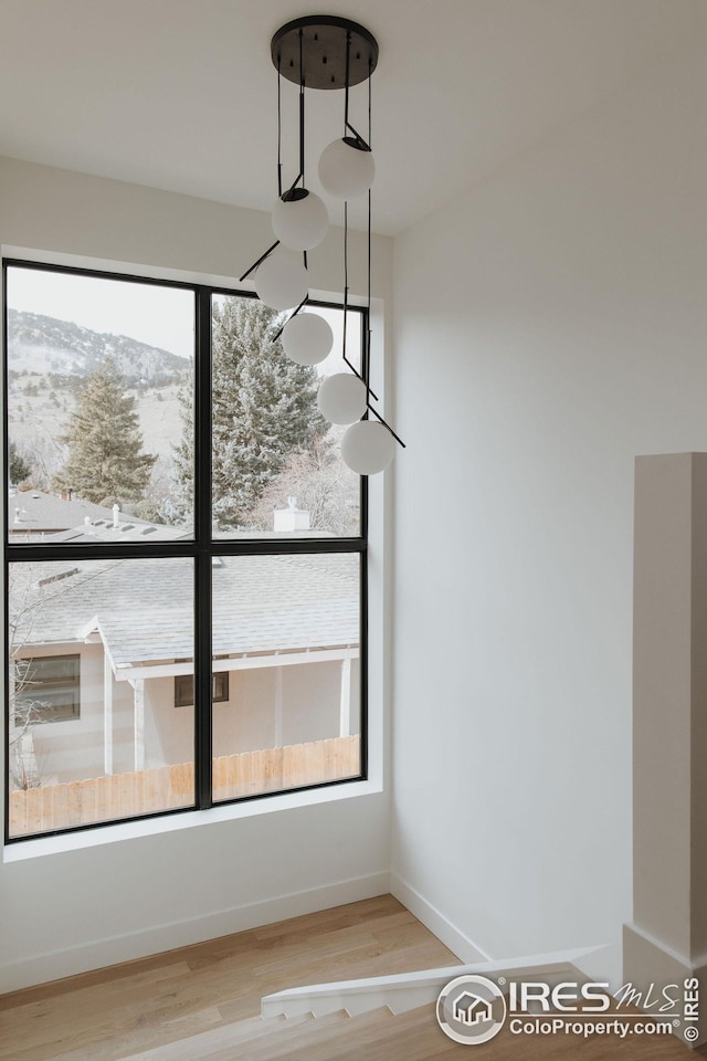 interior space featuring plenty of natural light and hardwood / wood-style floors