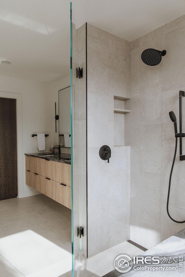 bathroom with vanity, a mountain view, and tile patterned floors