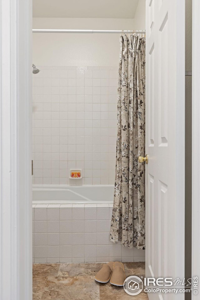 full bathroom featuring tiled shower / bath