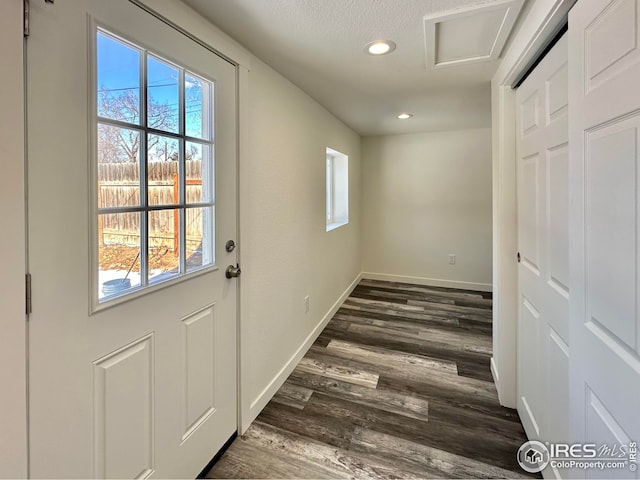 doorway to outside featuring recessed lighting, baseboards, and dark wood-style flooring