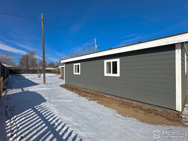 view of side of property with a fenced backyard