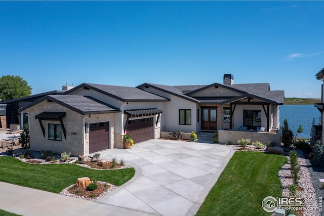 3806 Bridle Ridge Cir, Severance, CO 80524 - view of front facade with an attached garage, stone siding, a front lawn, and concrete driveway