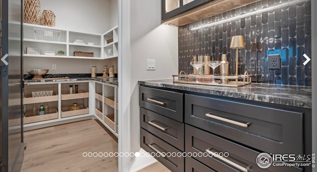 3806 Bridle Ridge Cir, Severance, CO 80524 - bar featuring light wood-style floors