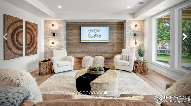 3806 Bridle Ridge Cir, Severance, CO 80524 - living area with plenty of natural light, wood finished floors, recessed lighting, and wood walls