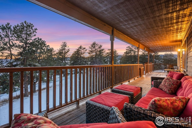 wooden terrace featuring outdoor lounge area