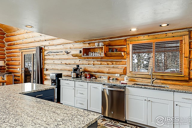 kitchen featuring log walls, stainless steel dishwasher, a sink, recessed lighting, and light stone counters