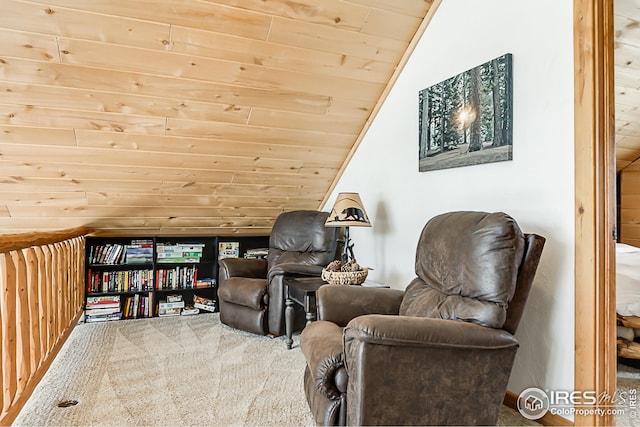 sitting room with wooden ceiling, vaulted ceiling, and carpet flooring