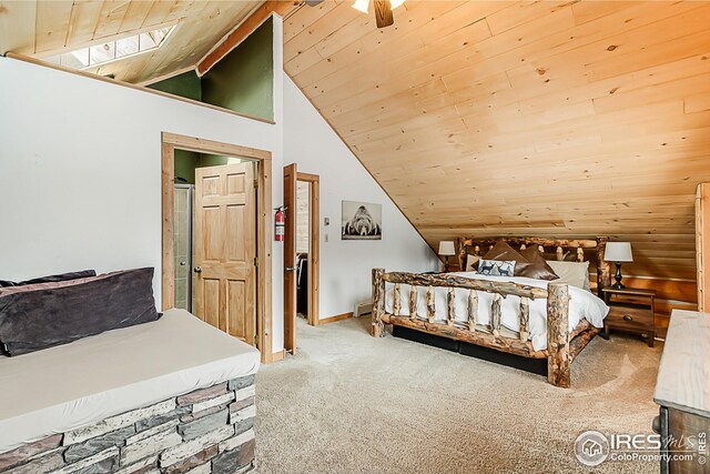 carpeted bedroom with vaulted ceiling, wood ceiling, and baseboards