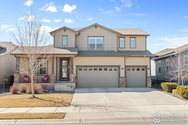 view of front of house featuring a garage, stone siding, driveway, and a shingled roof