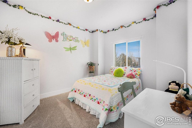 carpeted bedroom with ceiling fan and baseboards