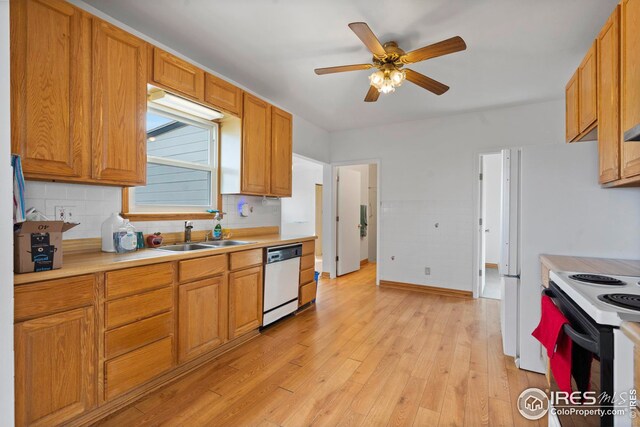 24525 County Road 53, Kersey, CO 80644 - kitchen with range with electric cooktop, dishwashing machine, light countertops, light wood-type flooring, and a sink