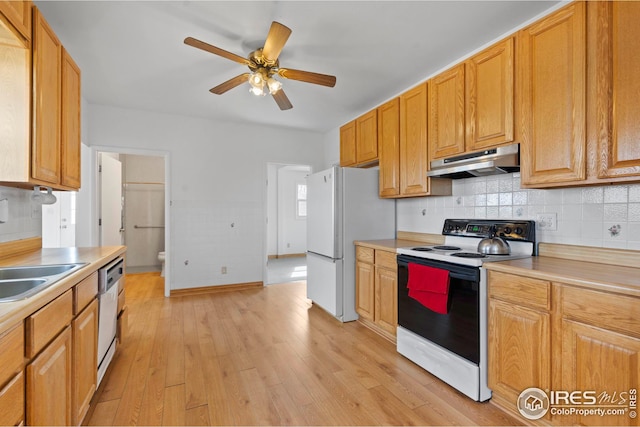 24525 County Road 53, Kersey, CO 80644 - kitchen featuring freestanding refrigerator, light countertops, range with electric stovetop, and under cabinet range hood