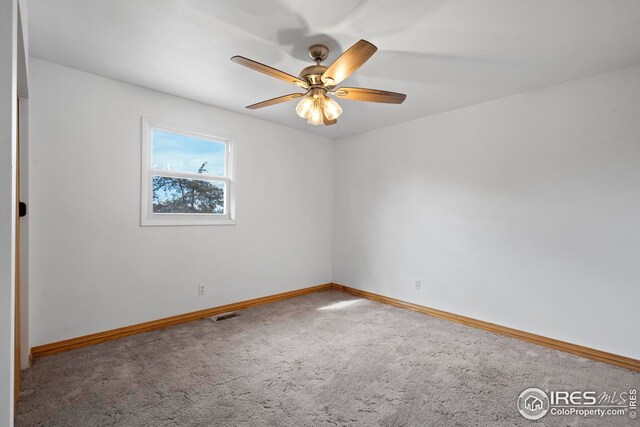 24525 County Road 53, Kersey, CO 80644 - unfurnished room with a ceiling fan, carpet, visible vents, and baseboards