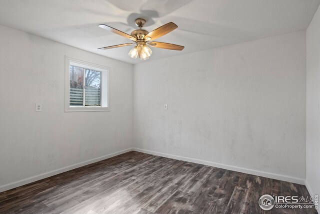 24525 County Road 53, Kersey, CO 80644 - spare room featuring ceiling fan, dark wood finished floors, and baseboards