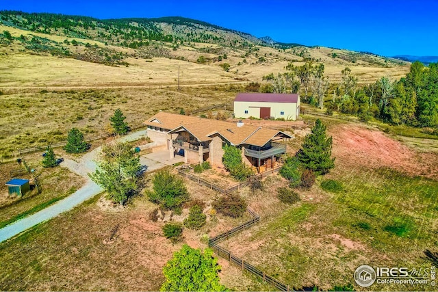 drone / aerial view with a rural view and a mountain view