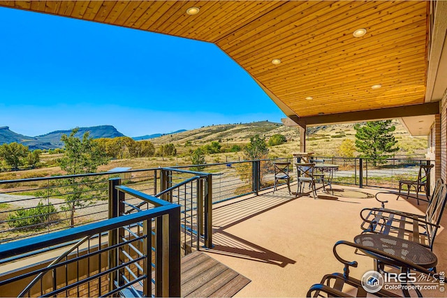 balcony featuring a mountain view