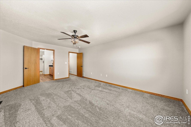 11837 County Road 39, Fort Lupton, CO 80621 - unfurnished bedroom with carpet floors, ceiling fan, and ensuite bath