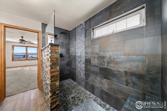 11837 County Road 39, Fort Lupton, CO 80621 - full bath featuring a walk in shower, a textured ceiling, wood finished floors, and ceiling fan