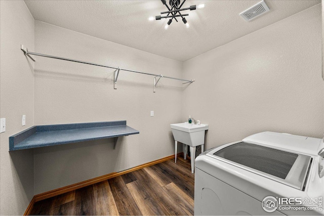 11837 County Road 39, Fort Lupton, CO 80621 - laundry room with washer and dryer and dark wood-style floors