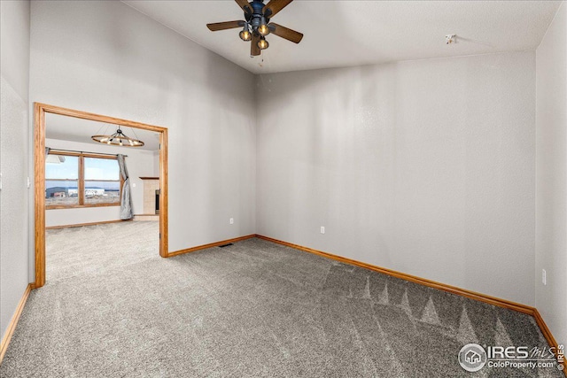 11837 County Road 39, Fort Lupton, CO 80621 - spare room featuring carpet floors, ceiling fan, and a chandelier